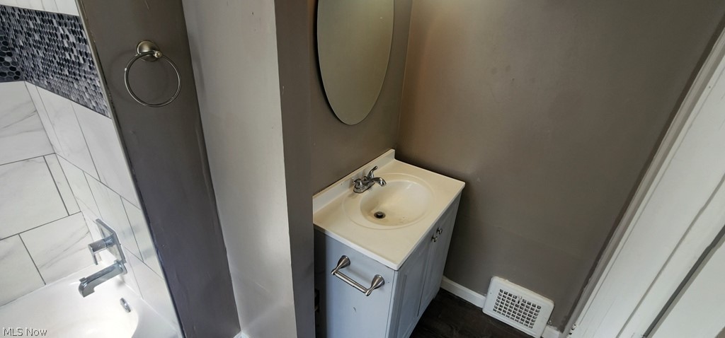 1514 Clermont Road Cleveland, OH 44110 - Photo 9 of 16 Bathroom with vanity and baseboards