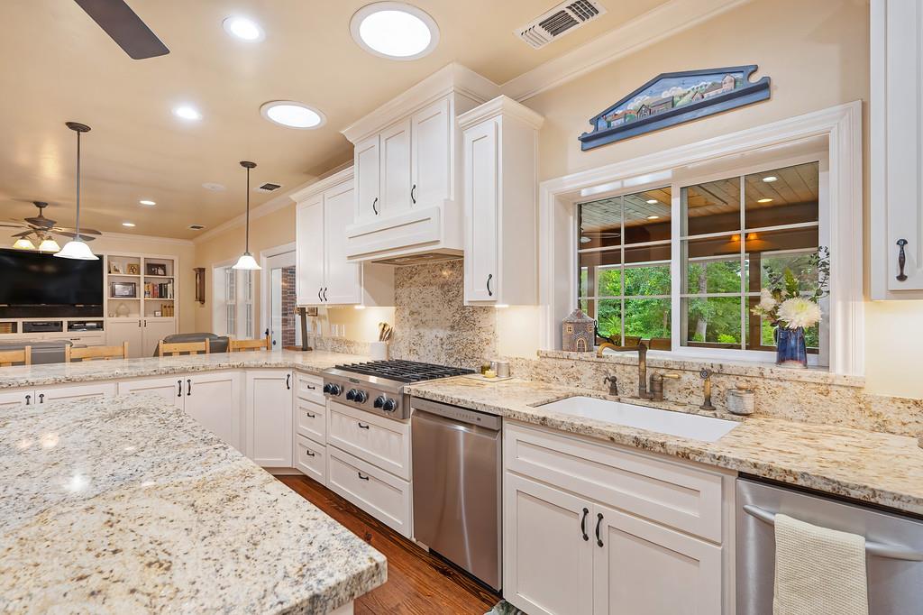 3557 Val Verde Road Loomis, CA 95650 - Photo 17 of 71 a kitchen with stainless steel appliances granite countertop a stove a sink and a microwave