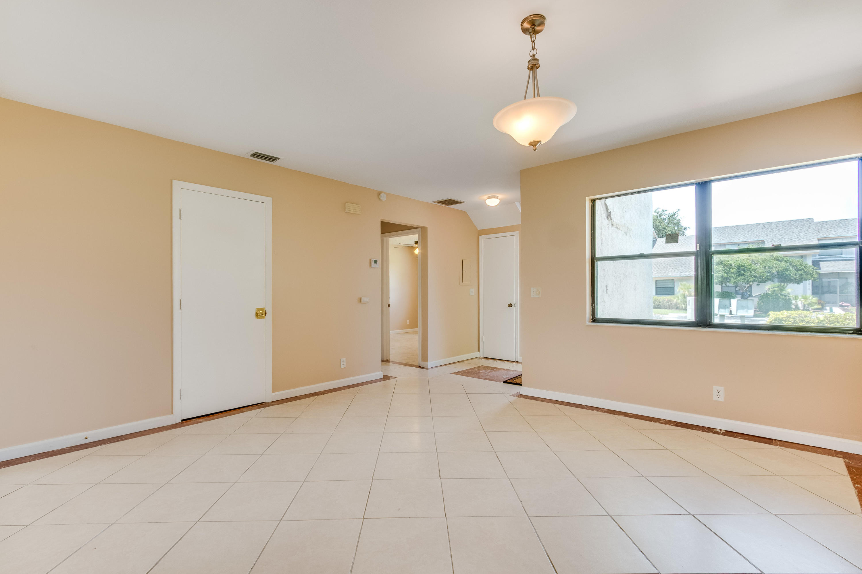 9273 Ketay Circle Boca Raton, FL 33428 - Photo 3 of 27 a view of an empty room with a window