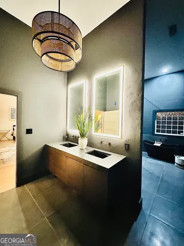 a view of a bathroom with a sink and a mirror