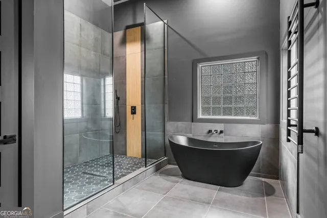 a bathroom with a tub and shower