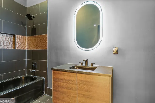 a bathroom with a sink and a mirror