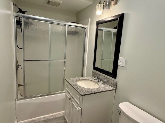 609 King Philip Street Fall River, MA 02724 - Photo 12 of 14 a bathroom with a granite countertop sink mirror vanity and toilet