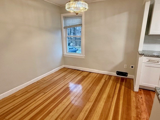 609 King Philip Street Fall River, MA 02724 - Photo 7 of 14 a view of a room with wooden floor and workspace