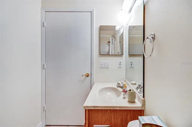 a bathroom with a sink and mirror