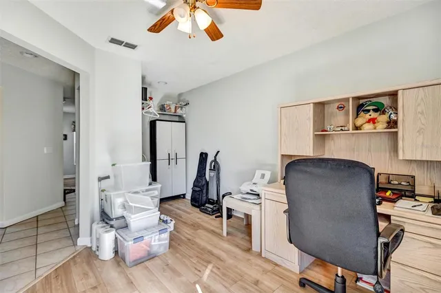 a view of a workspace with furniture and a workspace