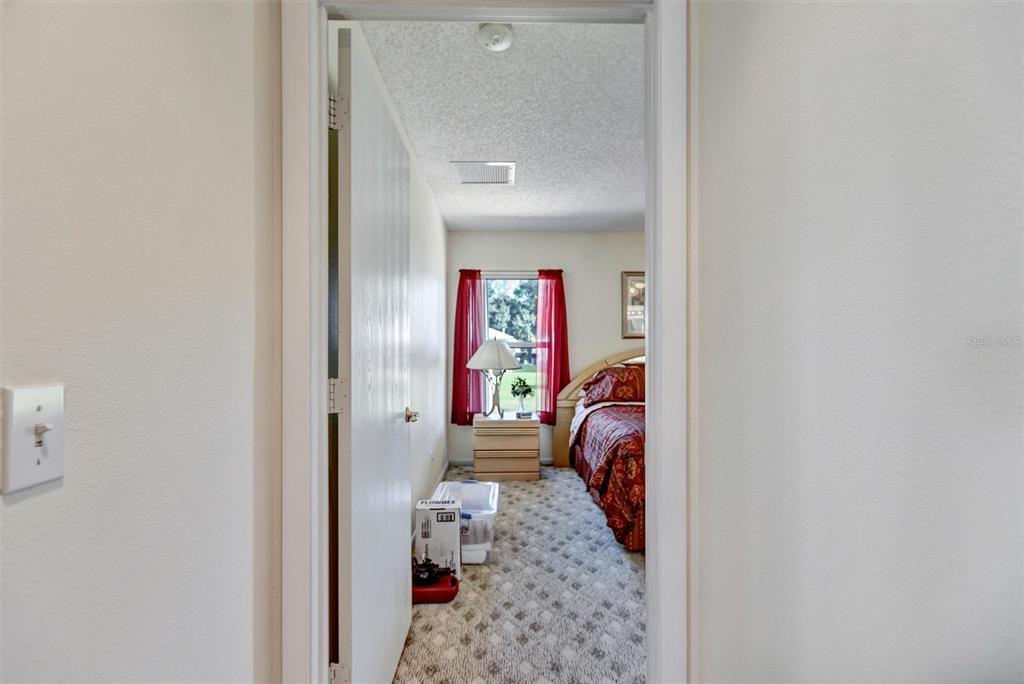 9485 Southwest 92nd Street Road Ocala, FL 34481 - Photo 25 of 38 a view of a hallway with a couch