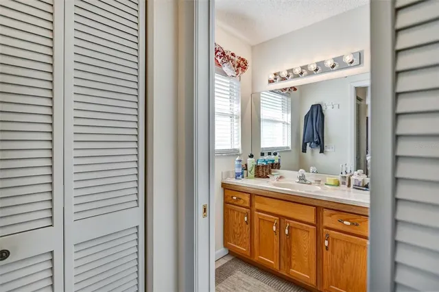 a bathroom with a double vanity sink and a mirror