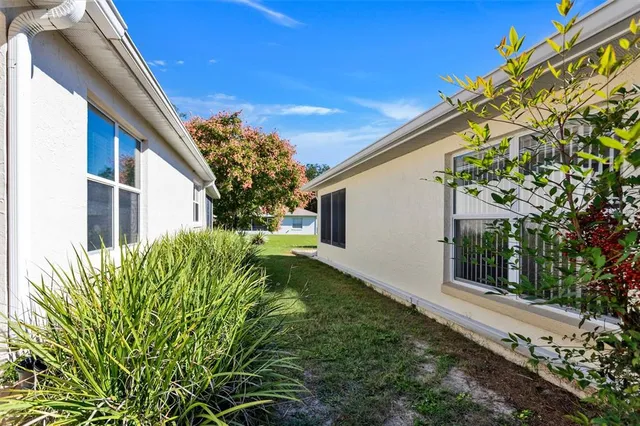 a backyard of a house with lots of green space