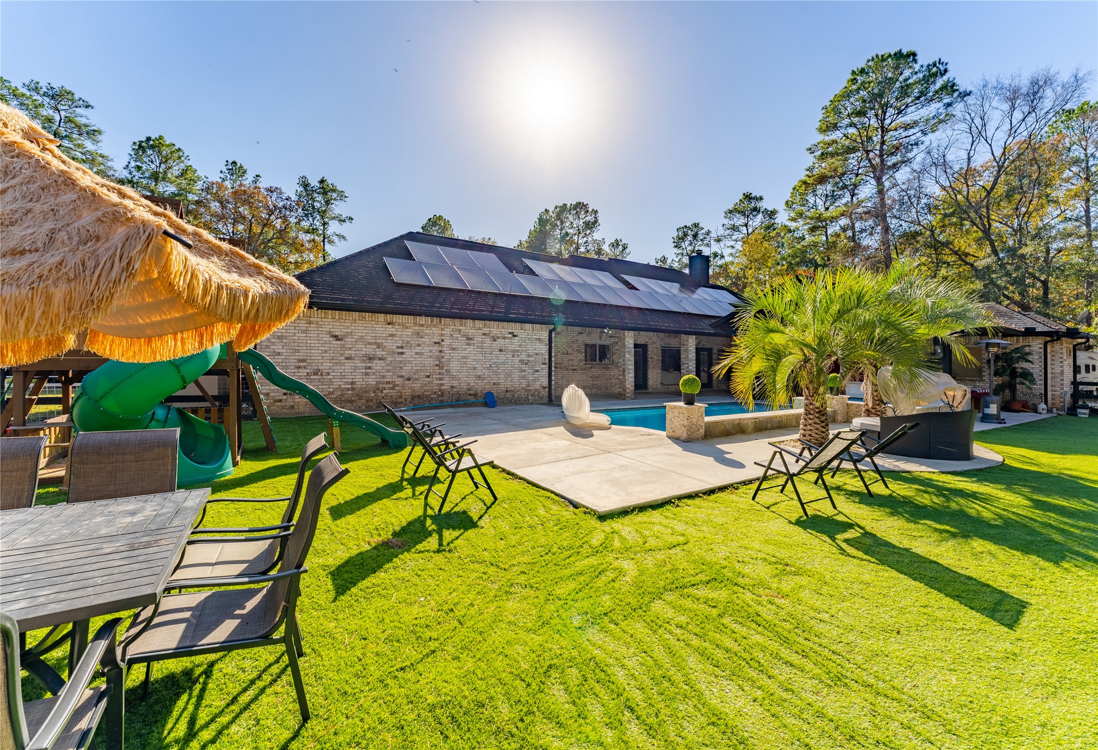 24102 Baneberry Road Magnolia, TX 77355 - Photo 19 of 39 a view of a swimming pool with a patio