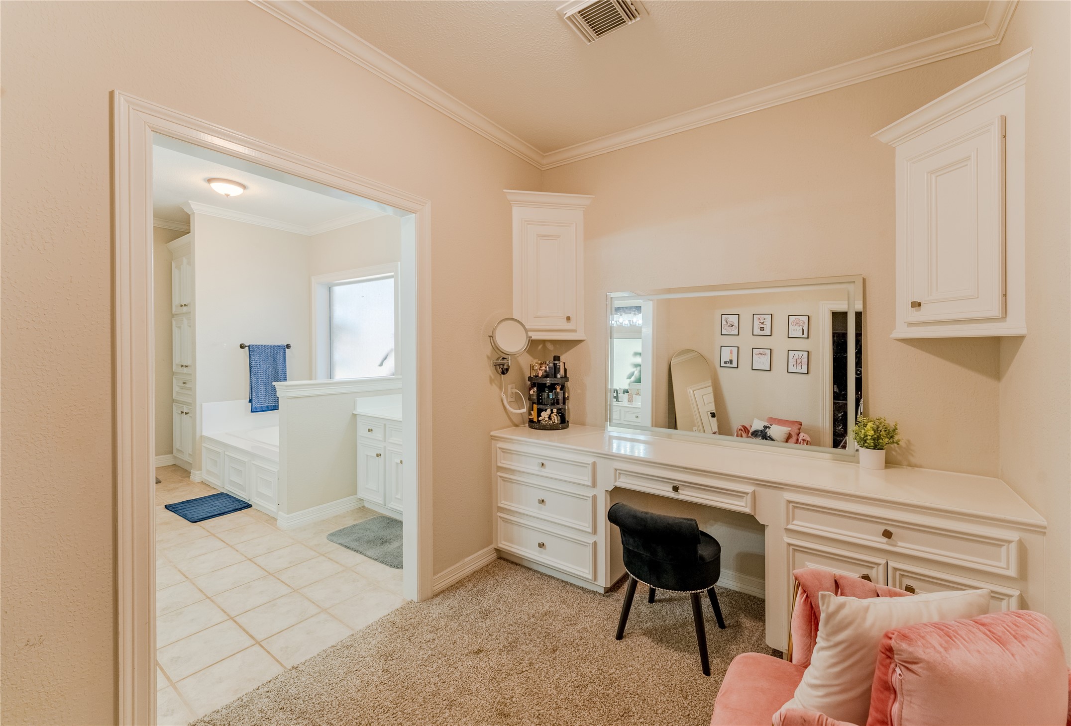 24102 Baneberry Road Magnolia, TX 77355 - Photo 24 of 39 a bedroom with a bed and a cabinets