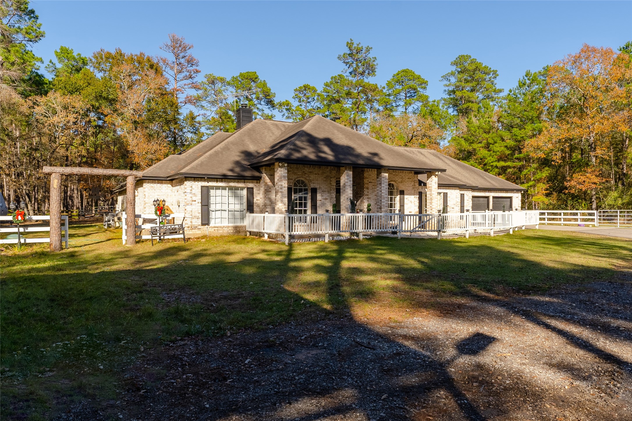 24102 Baneberry Road Magnolia, TX 77355 - Photo 33 of 39 a front view of a house with a yard table and chairs