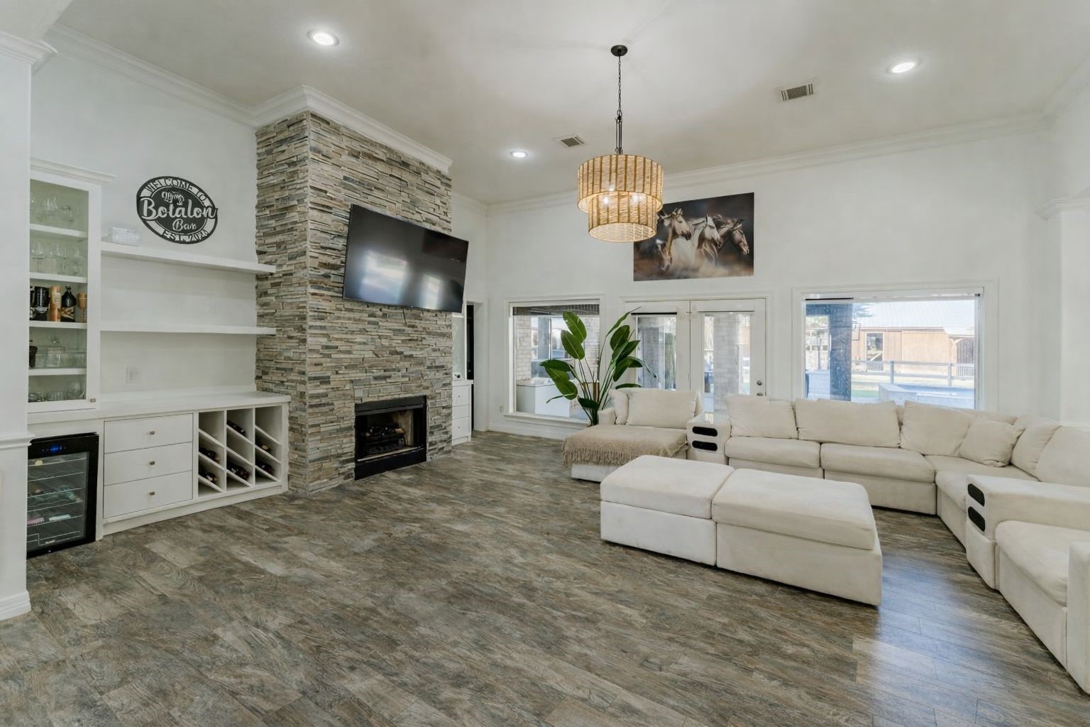 24102 Baneberry Road Magnolia, TX 77355 - Photo 4 of 39 a living room with furniture a fireplace and a flat screen tv
