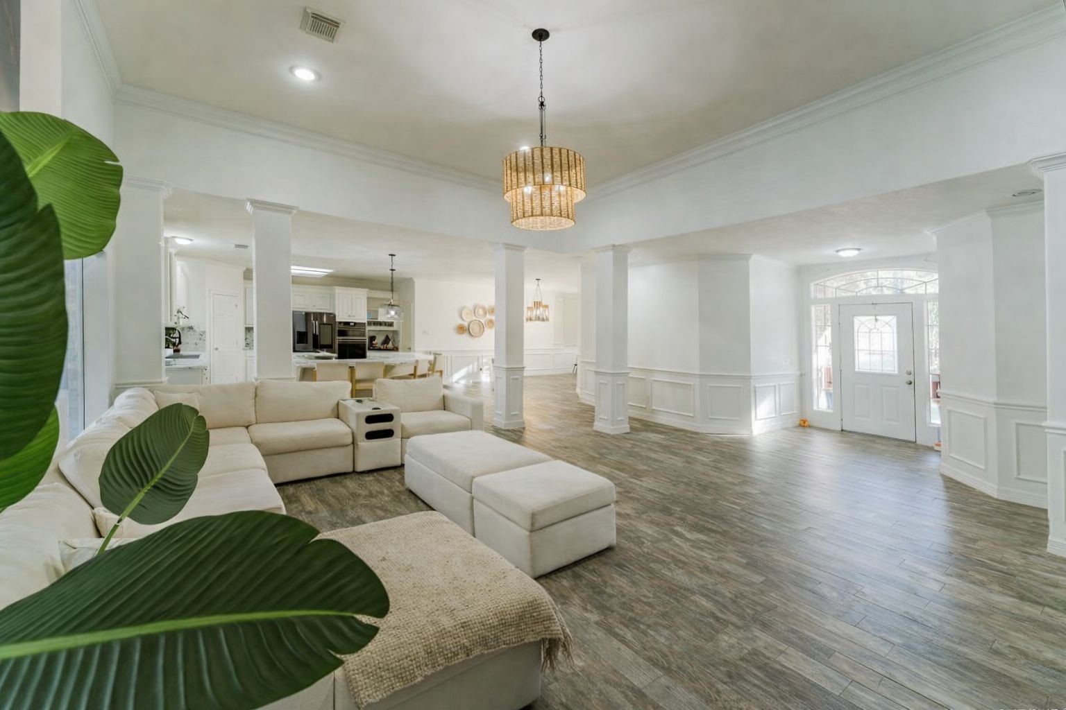 24102 Baneberry Road Magnolia, TX 77355 - Photo 8 of 39 a living room with furniture and a chandelier