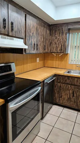 a kitchen with a stove and a microwave