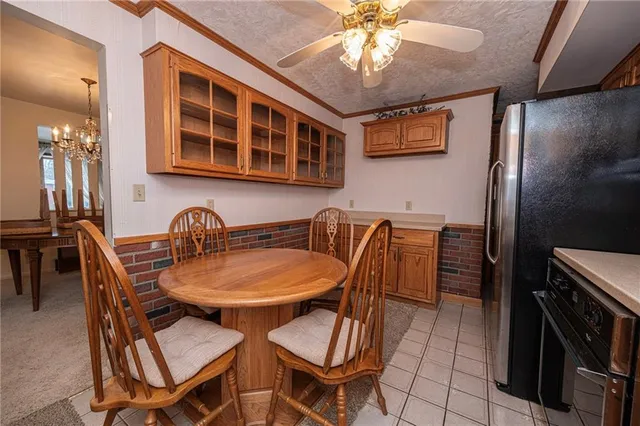 a dining room with furniture and chandelier