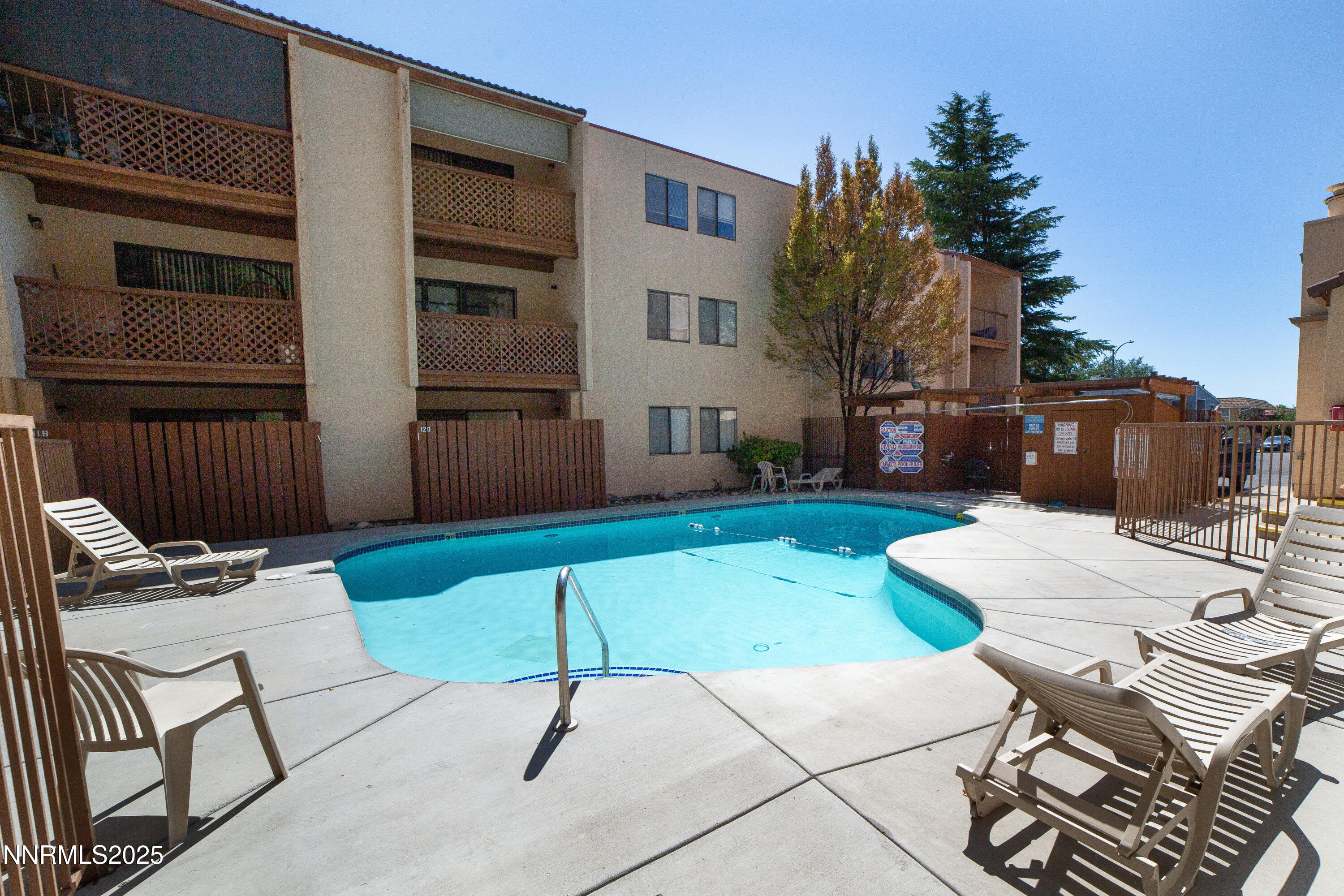 2700 Plumas Street, Unit 112 Reno, NV 89509 - Photo 15 of 17 a view of a patio with a table and chairs in patio