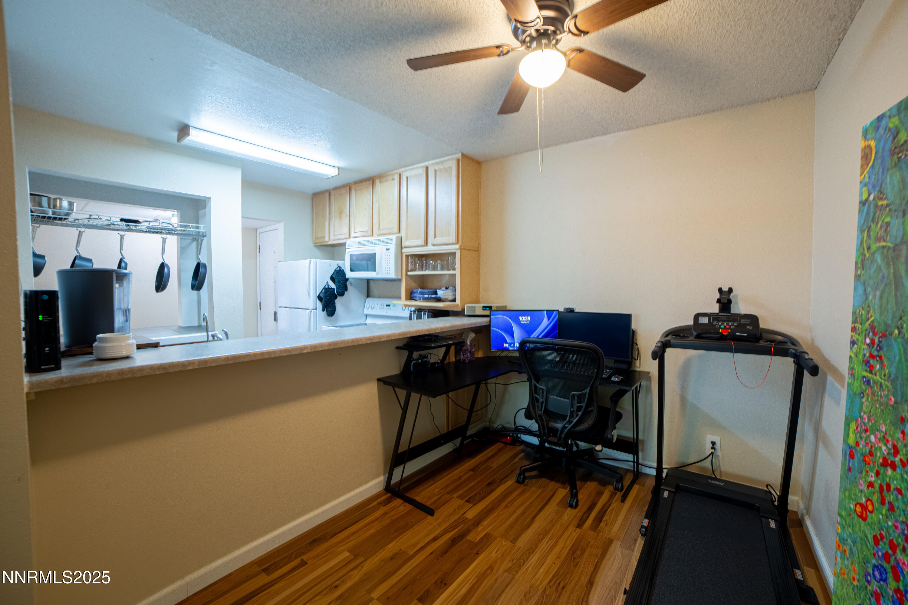 2700 Plumas Street, Unit 112 Reno, NV 89509 - Photo 6 of 17 a view of a workspace with furniture and a window