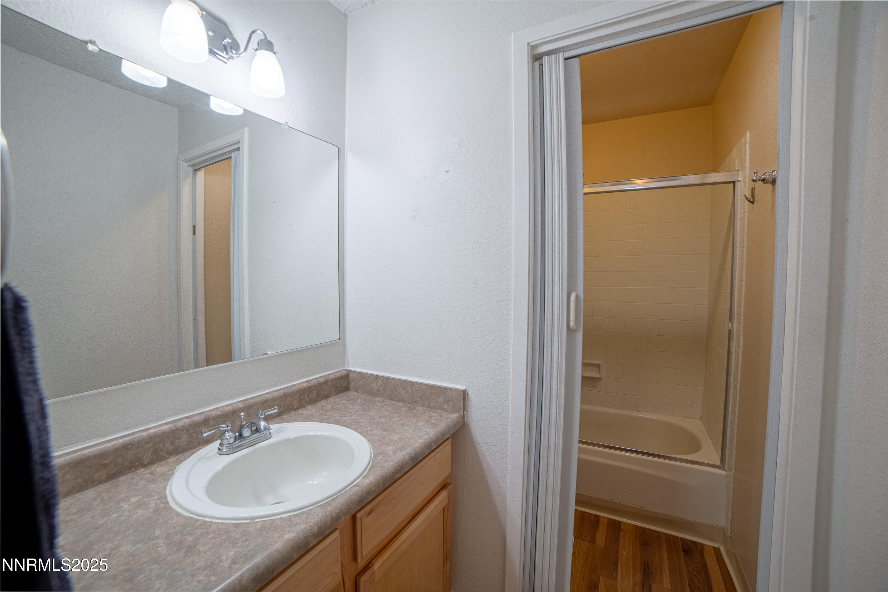 2700 Plumas Street, Unit 112 Reno, NV 89509 - Photo 10 of 17 a bathroom with a sink and a mirror