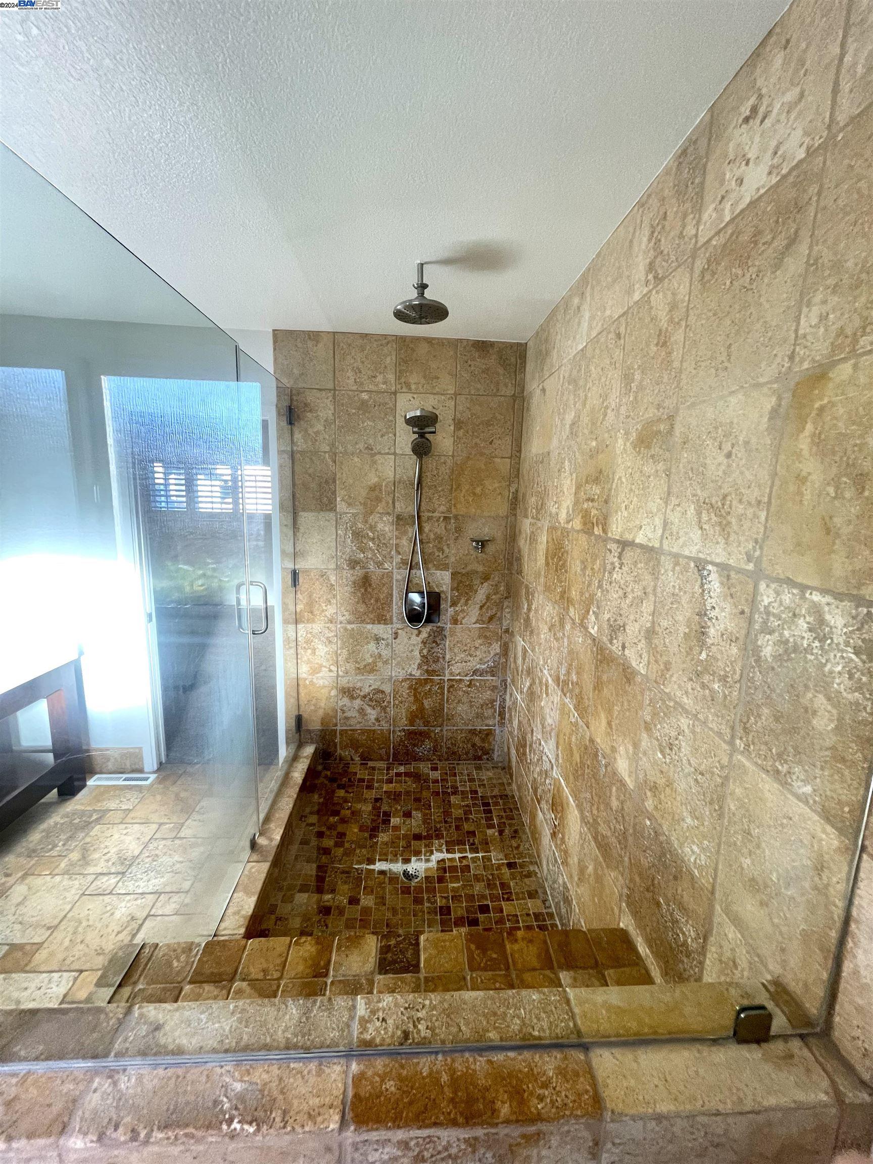 1361 Hudson Way Livermore, CA 94550 - Photo 16 of 23 a bathroom with a shower