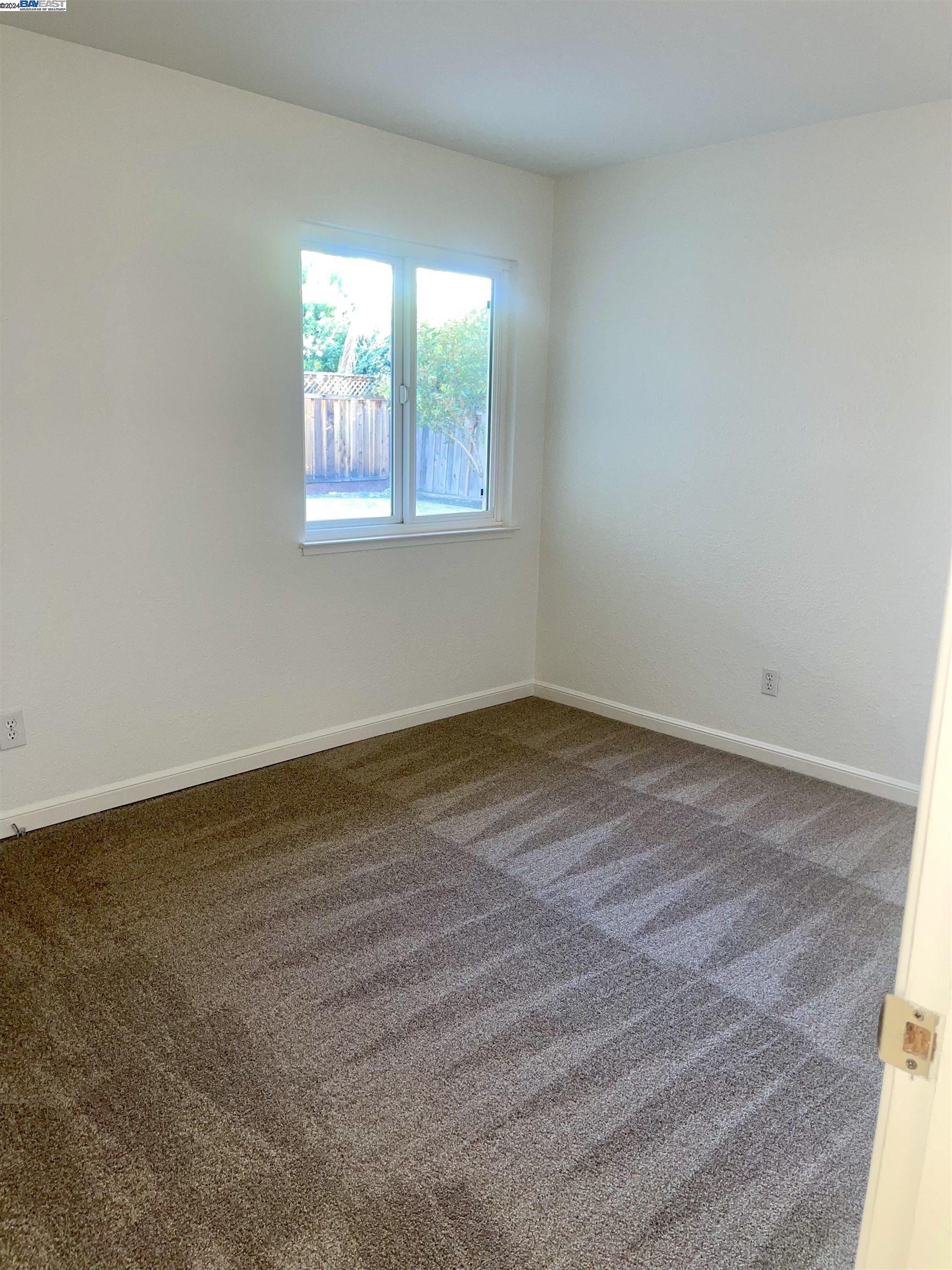 1361 Hudson Way Livermore, CA 94550 - Photo 20 of 23 wooden floor in an empty room with a window