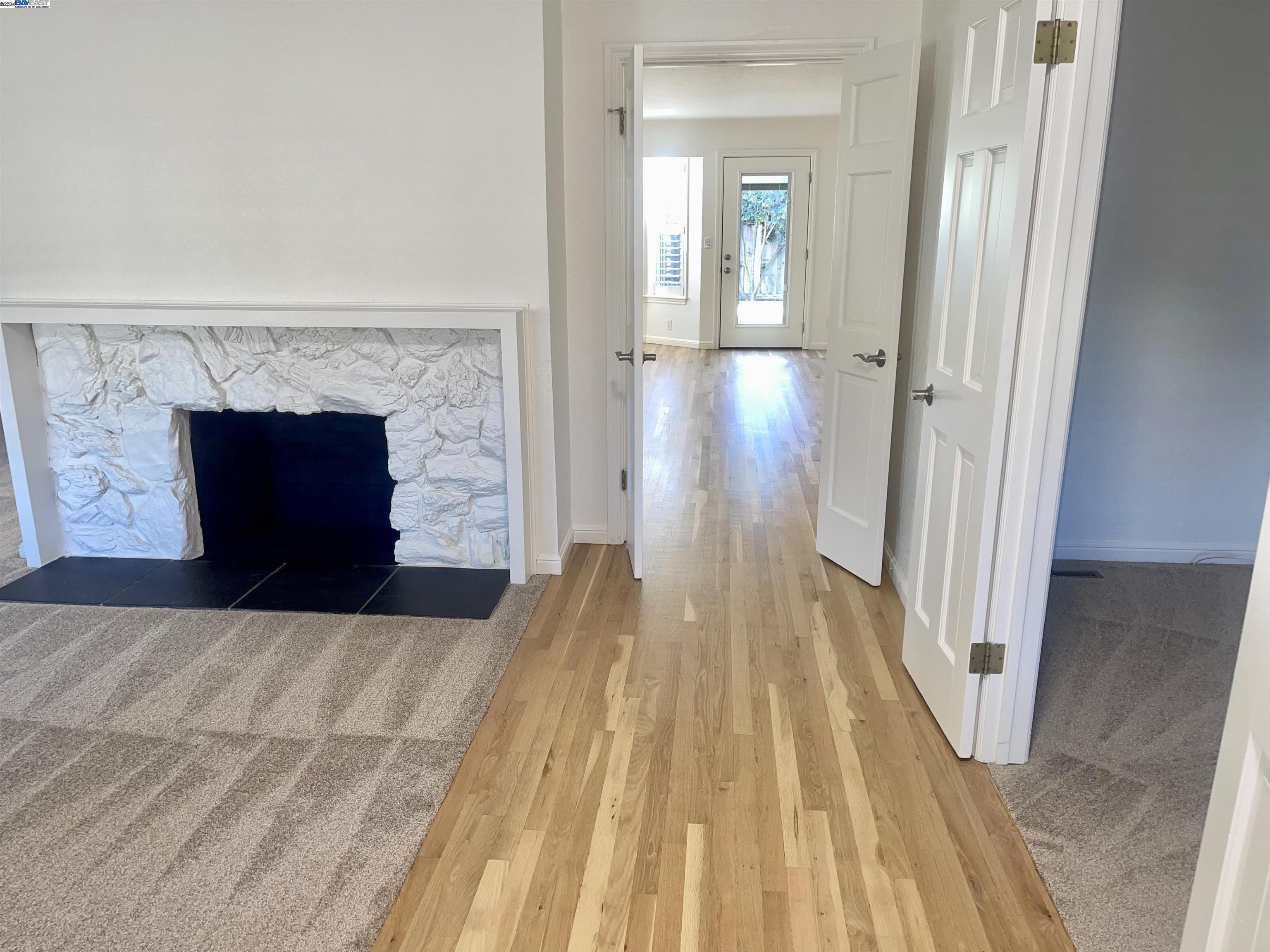 1361 Hudson Way Livermore, CA 94550 - Photo 2 of 23 a view of a livingroom with wooden floor and a fireplace