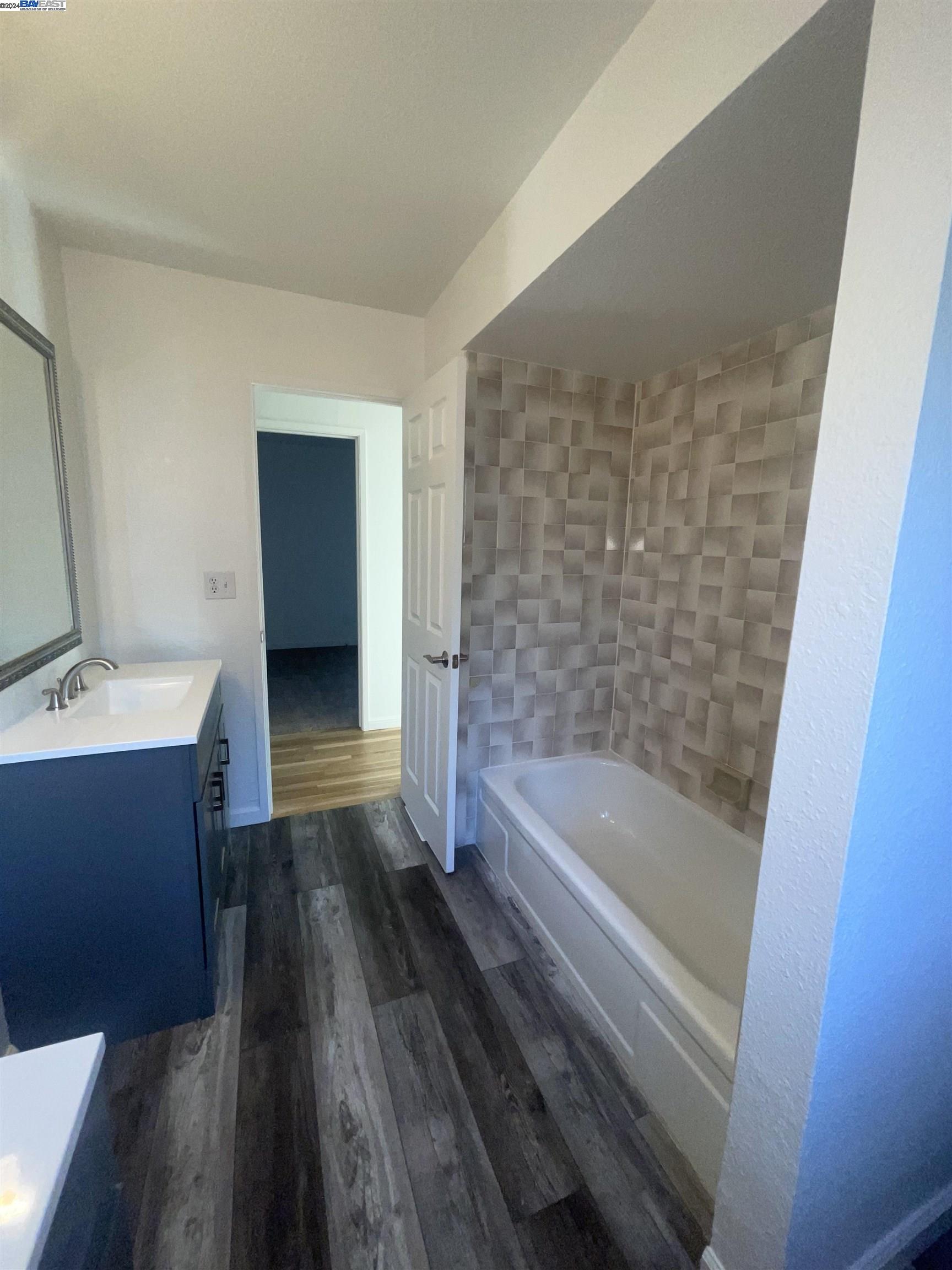 1361 Hudson Way Livermore, CA 94550 - Photo 21 of 23 a bathroom with a bathtub and a sink