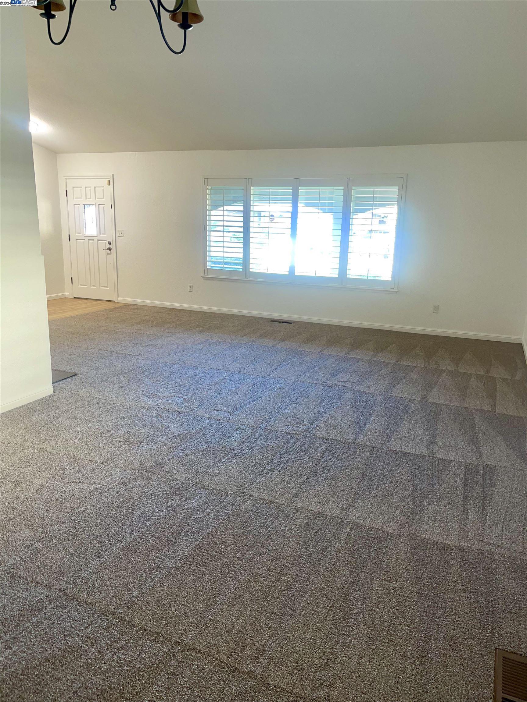 1361 Hudson Way Livermore, CA 94550 - Photo 5 of 23 a view of an empty room with a window