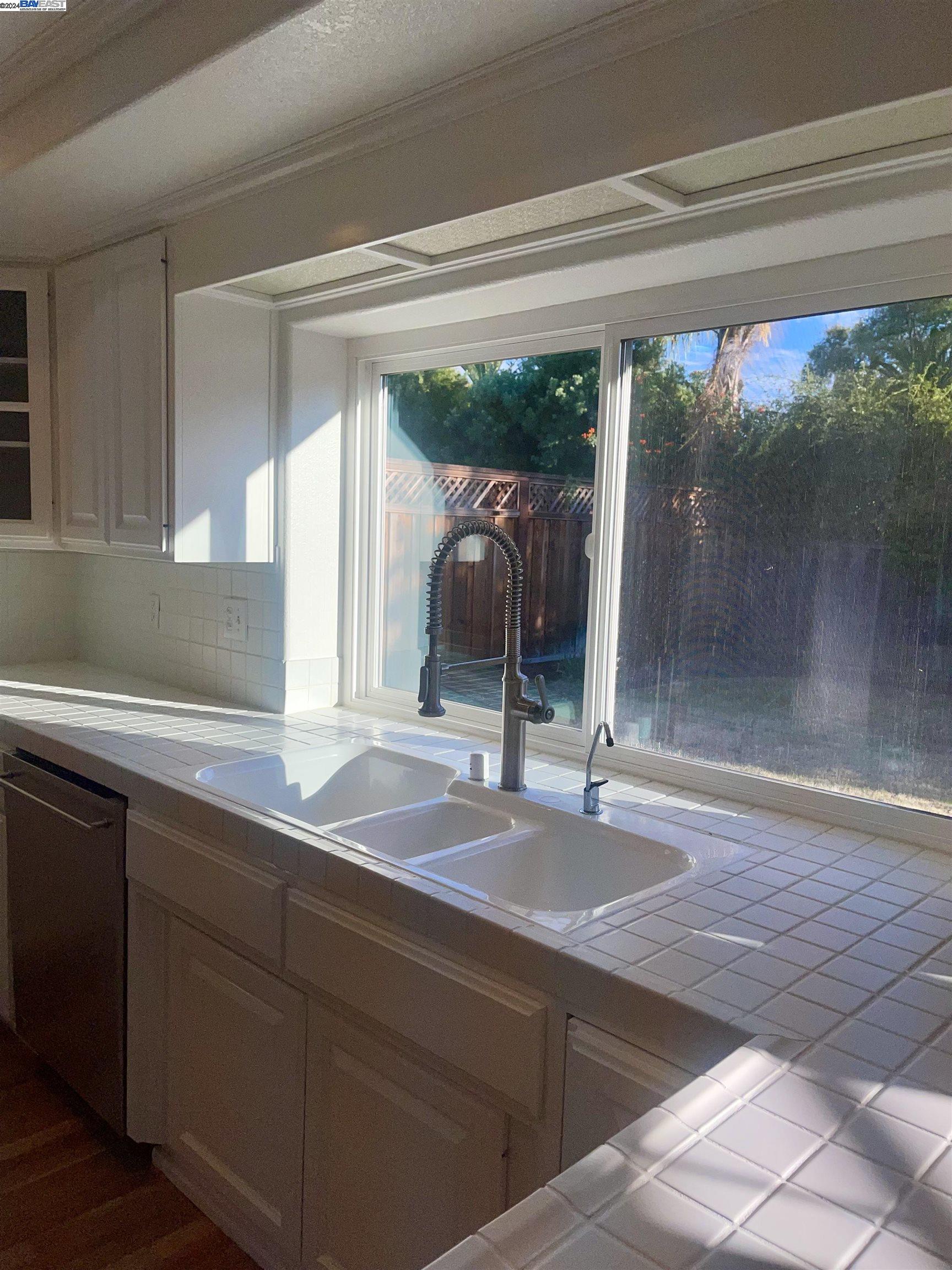 1361 Hudson Way Livermore, CA 94550 - Photo 10 of 23 a bathroom with a sink and mirror