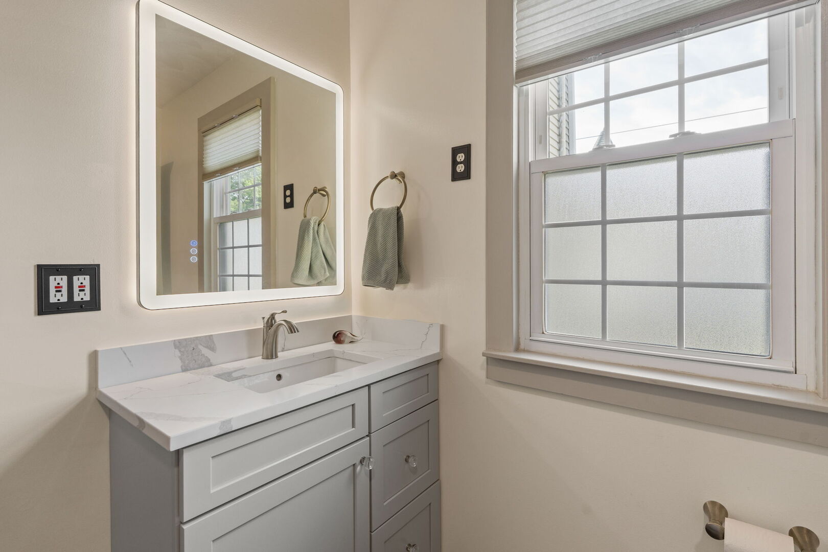 417 North State Street Geneseo, IL 61254 - Photo 25 of 51 a bathroom with a sink and a mirror