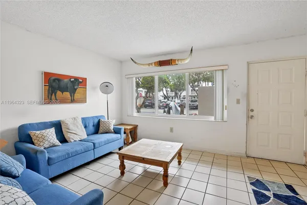 a living room with furniture and a window