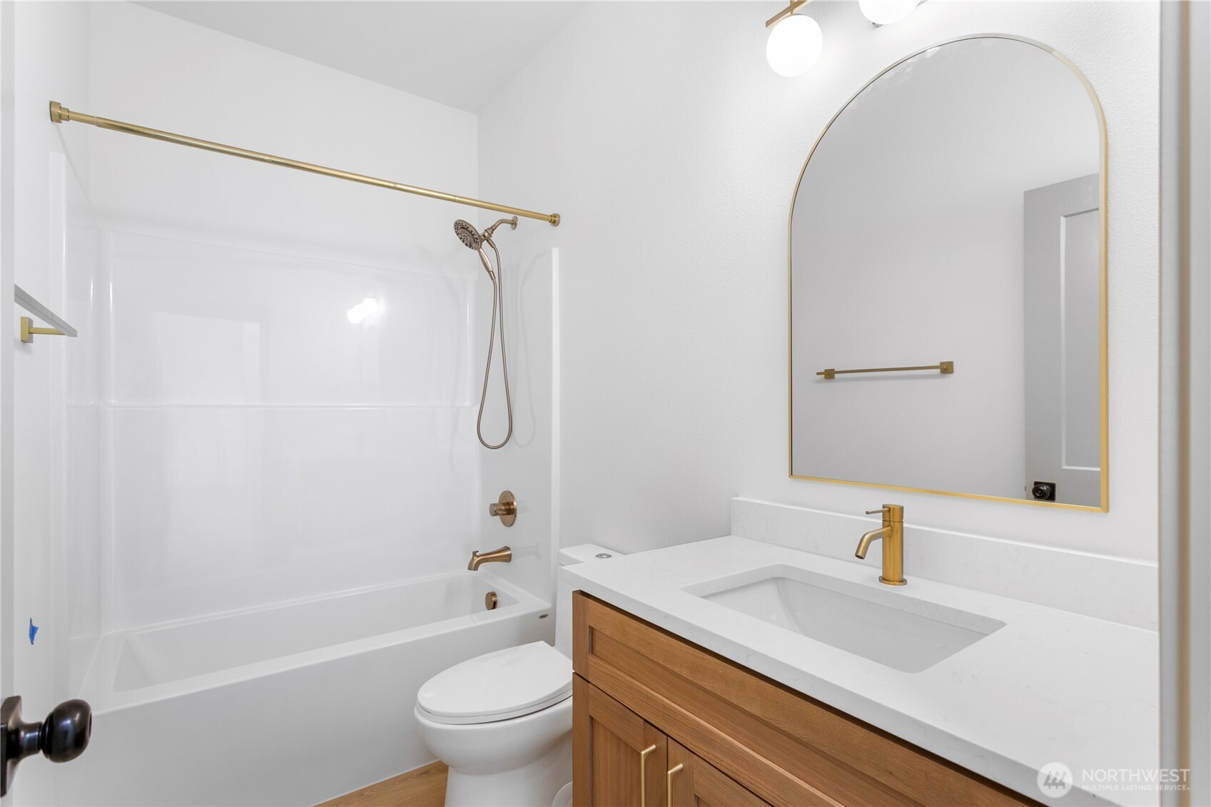 2333 West Castleman Street Longview, WA 98632 - Photo 19 of 39 a bathroom with a granite countertop sink a toilet and shower