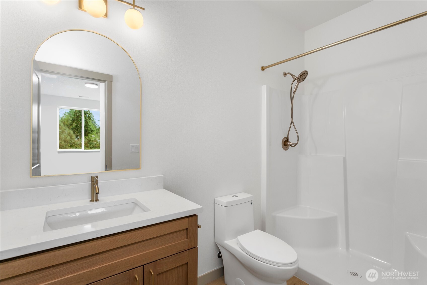 2333 West Castleman Street Longview, WA 98632 - Photo 26 of 39 a bathroom with a granite countertop sink toilet a mirror and shower