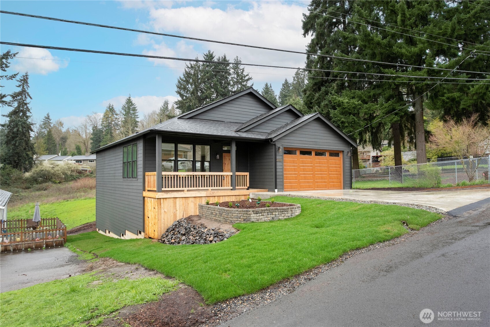 2333 West Castleman Street Longview, WA 98632 - Photo 32 of 39 a view of a yard in front of a house with large tree