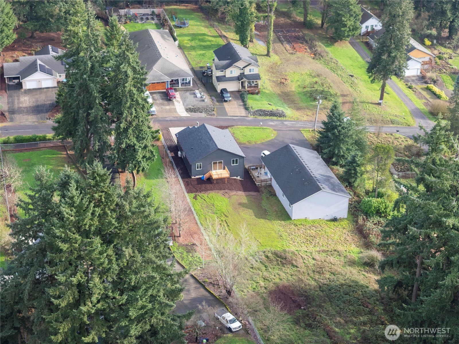 2333 West Castleman Street Longview, WA 98632 - Photo 36 of 39 an aerial view of a house with swimming pool and large trees