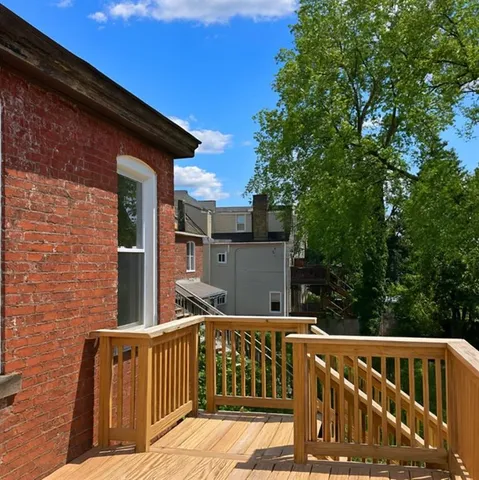 a view of balcony with small garden