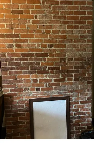 a close view of a bathroom with a sink and a mirror