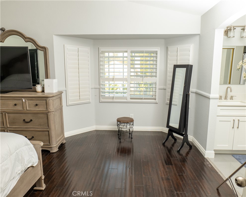 2831 Carma Court Riverside, CA 92503 - Photo 12 of 20 a living room with chair flat screen tv and a window