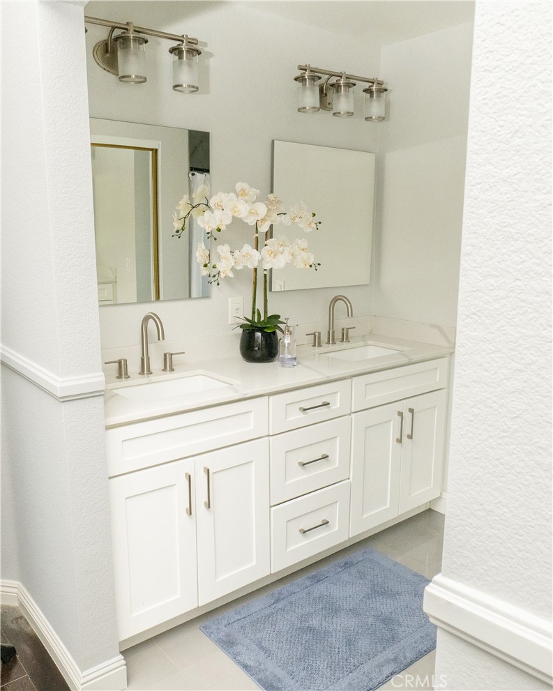 2831 Carma Court Riverside, CA 92503 - Photo 13 of 20 a bathroom with a sink vanity and mirror
