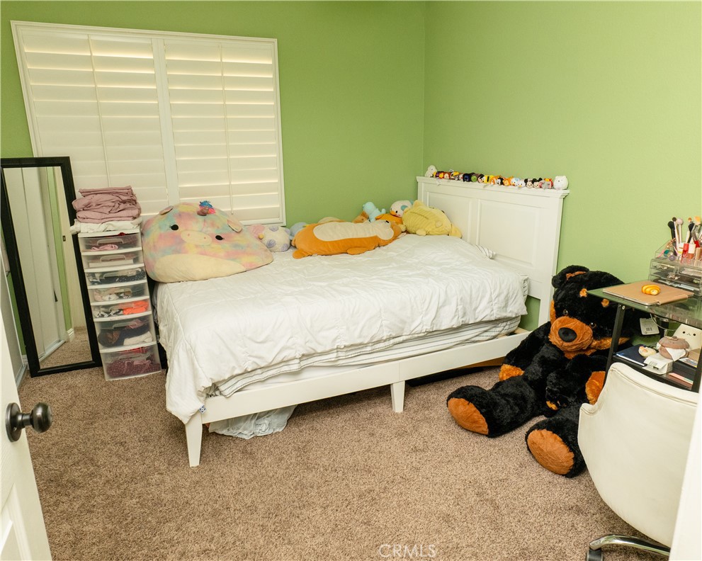2831 Carma Court Riverside, CA 92503 - Photo 14 of 20 a bedroom with a bed and a dresser
