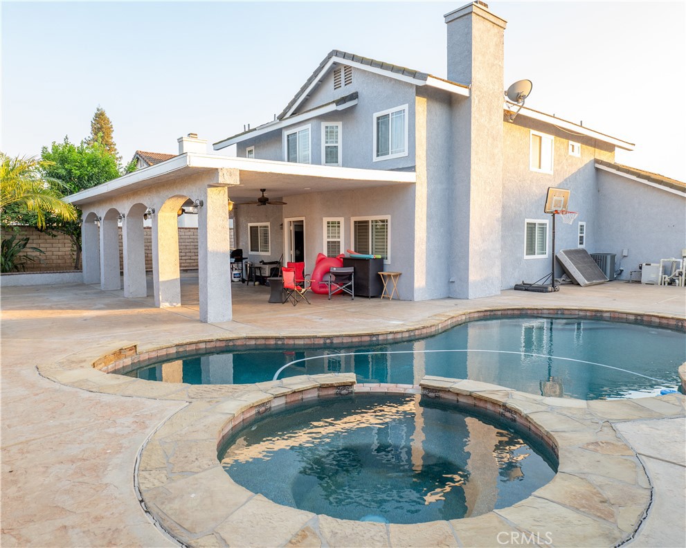 2831 Carma Court Riverside, CA 92503 - Photo 17 of 20 a view of a house with a swimming pool