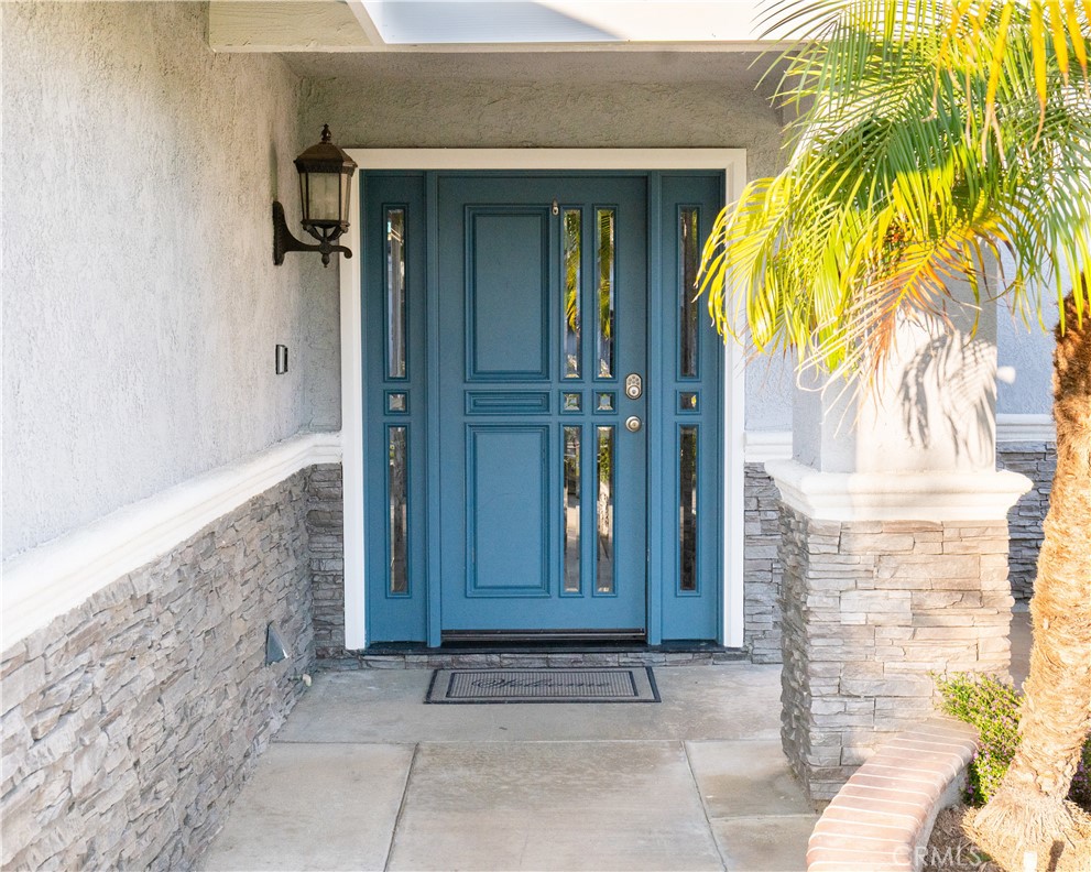 2831 Carma Court Riverside, CA 92503 - Photo 2 of 20 a view of a brick house with potted plants