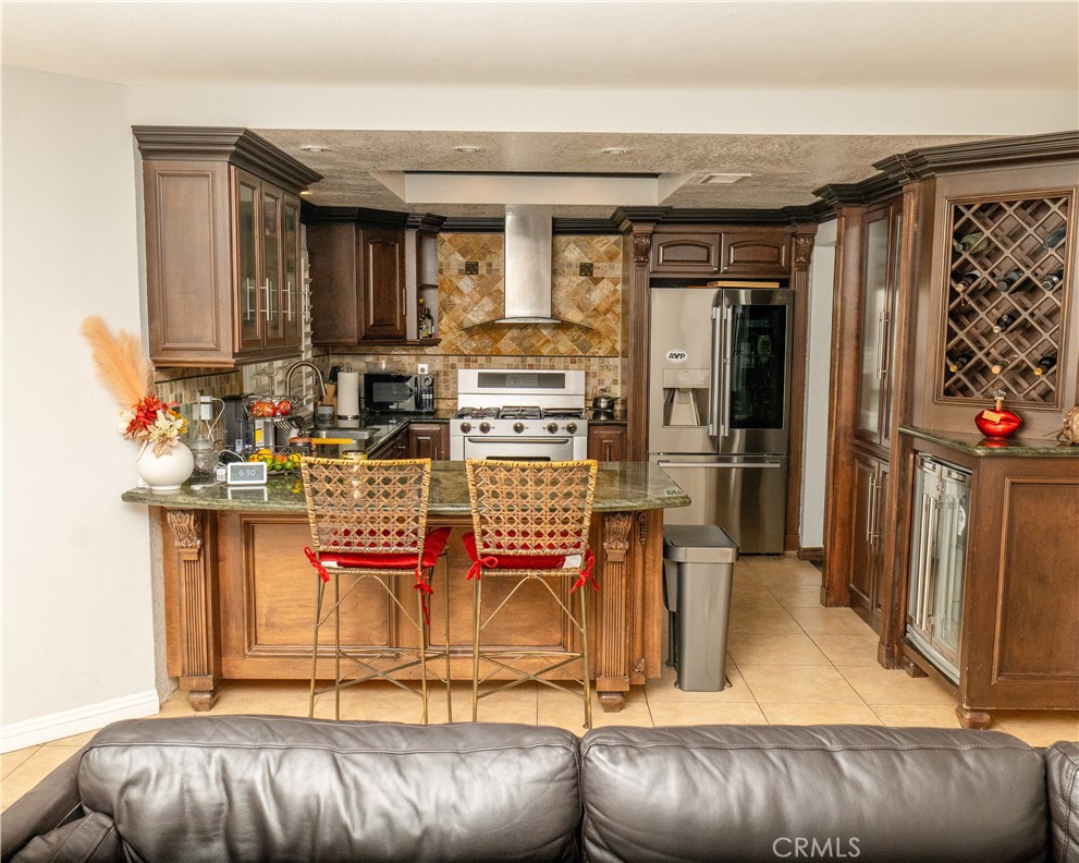 2831 Carma Court Riverside, CA 92503 - Photo 8 of 20 a living room with furniture and a fireplace