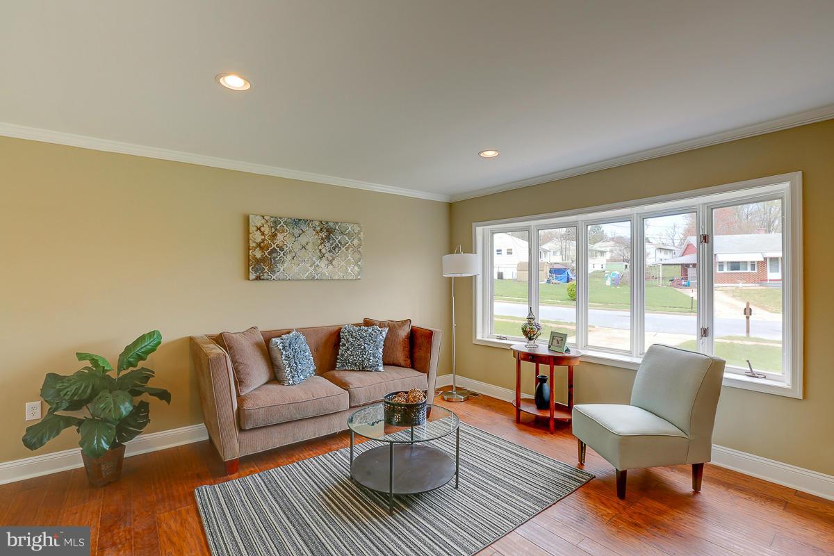 144 Embleton Road Owings Mills, MD 21117 - Photo 1 of 26 a living room with furniture and a large window