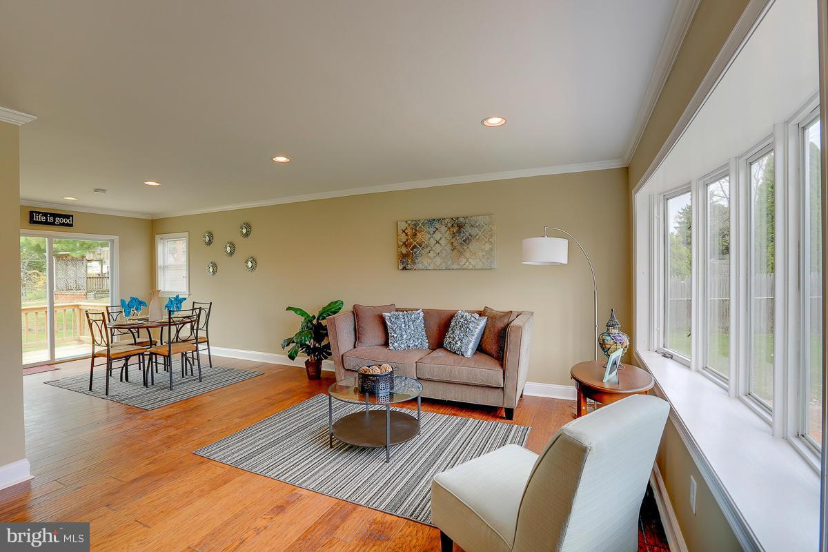 144 Embleton Road Owings Mills, MD 21117 - Photo 2 of 26 a living room with furniture and a table