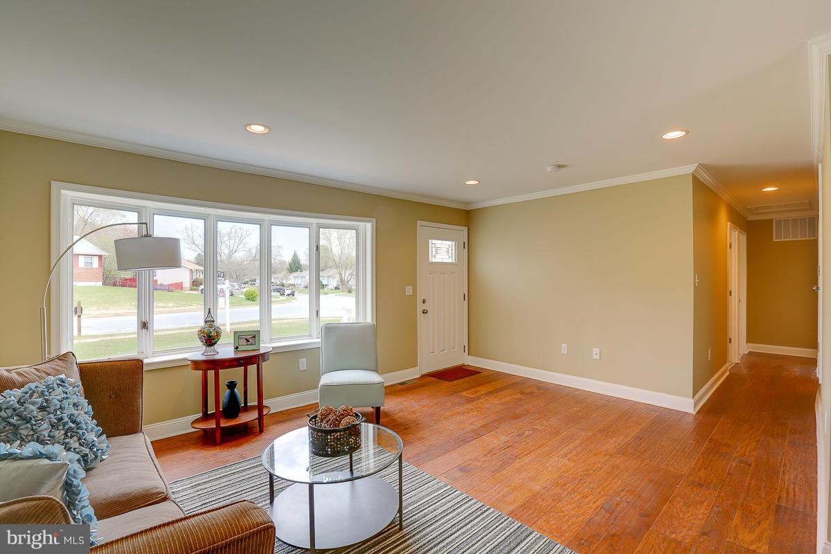 144 Embleton Road Owings Mills, MD 21117 - Photo 3 of 26 a living room with furniture and a large window