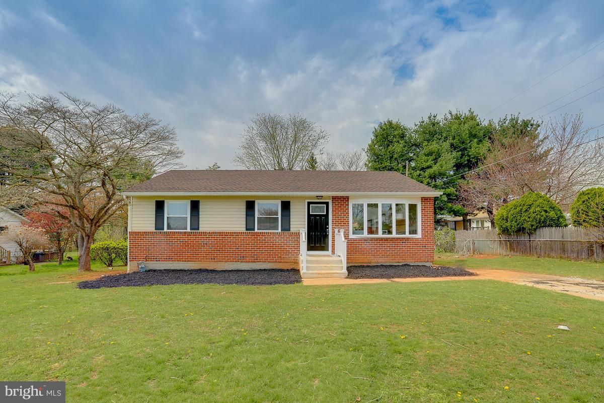 144 Embleton Road Owings Mills, MD 21117 - Photo 21 of 26 a front view of a house with a garden