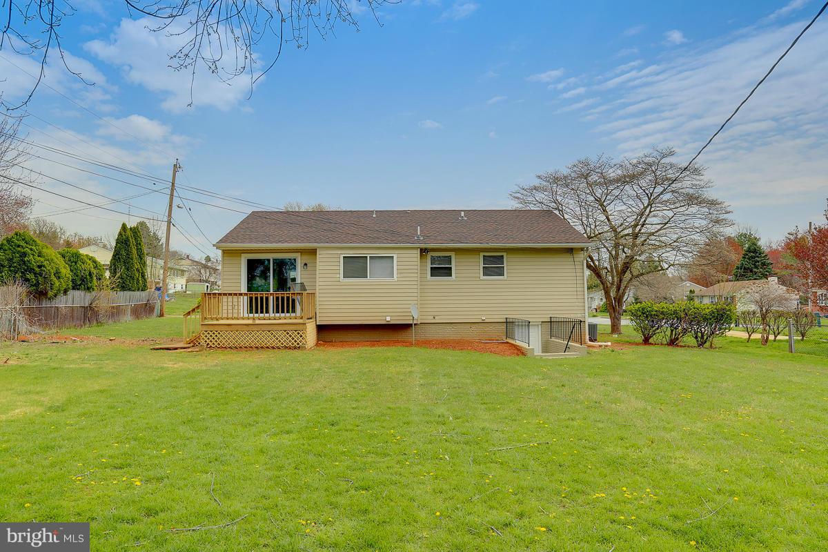 144 Embleton Road Owings Mills, MD 21117 - Photo 23 of 26 a front view of a house with a yard