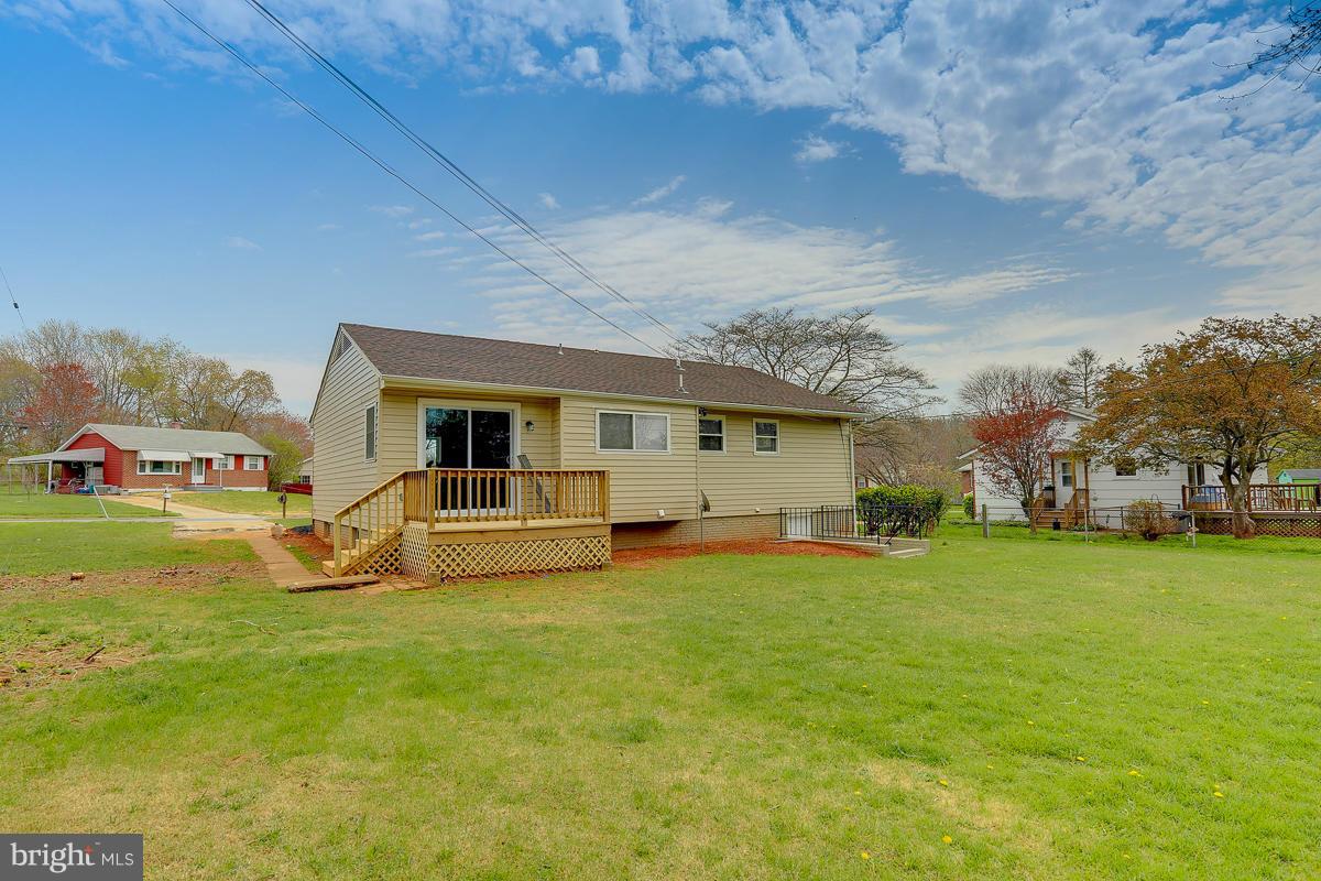 144 Embleton Road Owings Mills, MD 21117 - Photo 26 of 26 a view of a house with a big yard and sitting area
