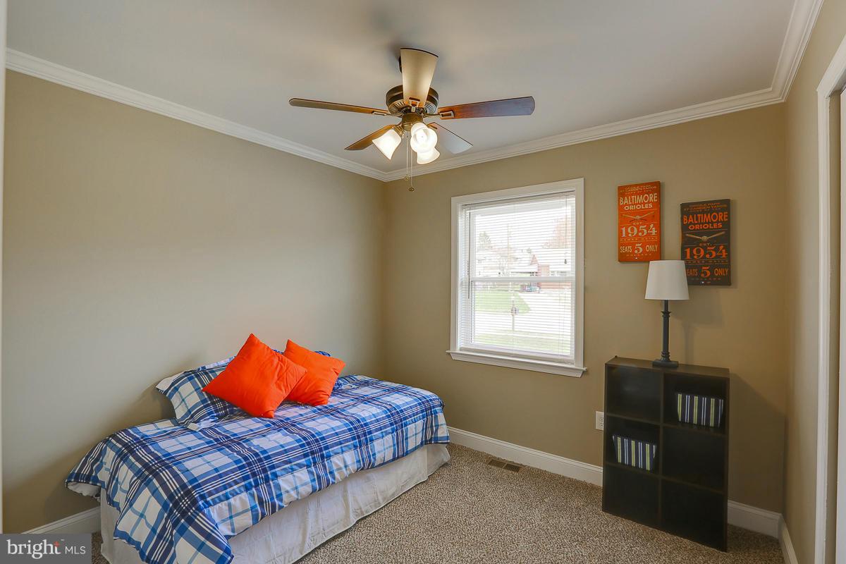 144 Embleton Road Owings Mills, MD 21117 - Photo 9 of 26 a bedroom with furniture and a window